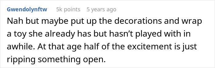 Screenshot of a Reddit comment suggesting to put up decorations and wrap an existing toy due to Christmas affordability concerns.