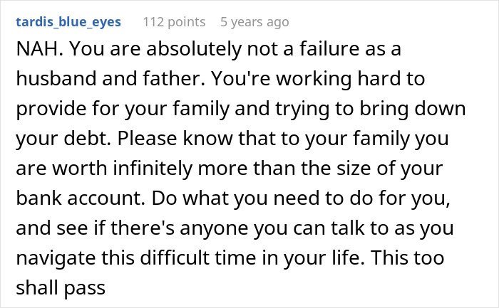 Reddit comment offering support to a father struggling with debt and considering canceling Christmas due to affordability.