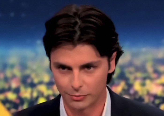 Young man in suit in a studio setting as Scott Jennings hits back at Michael Douglas and Zeta-Jones over nepo baby debate flop.