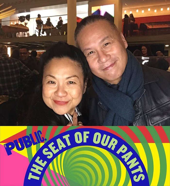 BD Wong smiling with a woman at an event, related to Jurassic World star issuing apology for racist comment.