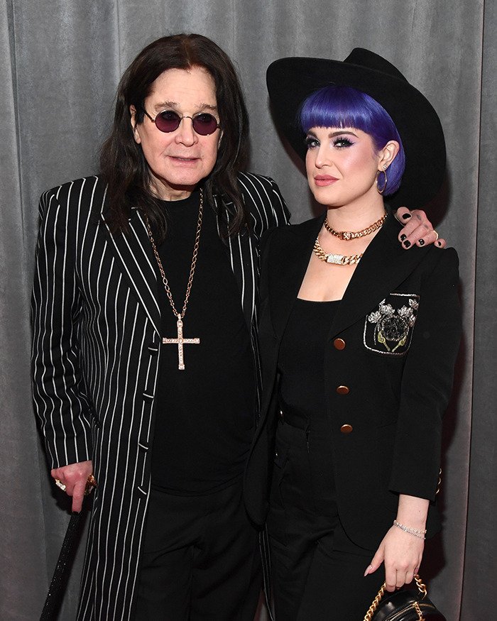 Ozzy Osbourne and Kelly Osbourne pose together at an event, highlighting fans' attention on Kelly's transformation.