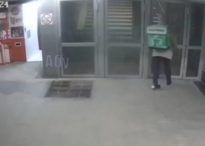CCTV footage showing delivery man walking near entrance before kicking woman in the head in a random attack caught on camera.