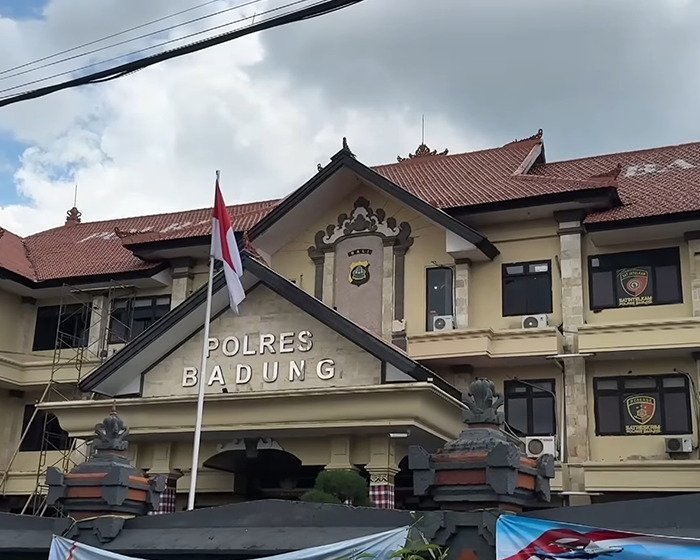 Police station building with flagpole in front, related to Bonnie Blue arrested during controversial tour keywords.