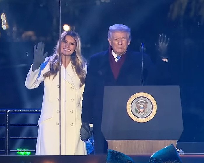 Melania and former president at tree lighting event, her behavior sparking speculation and conspiracy theories.