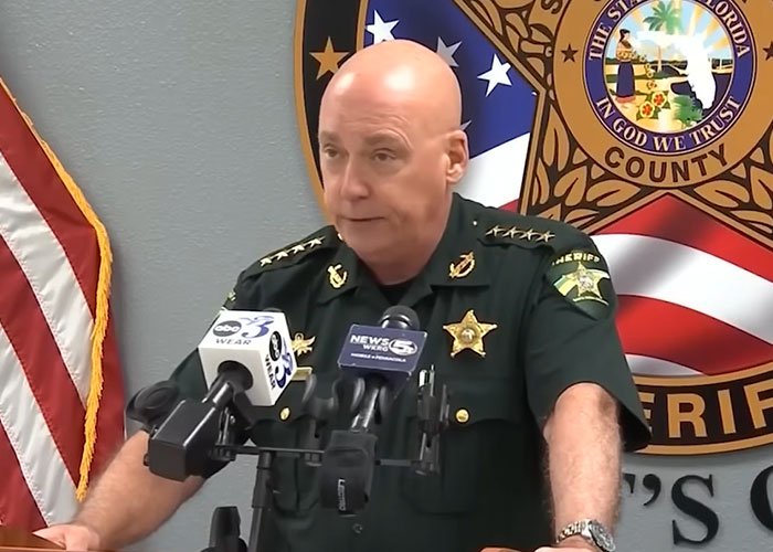 Sheriff speaking at a press conference about two teens charged with homicide after brutal attack on 14-year-old girl.