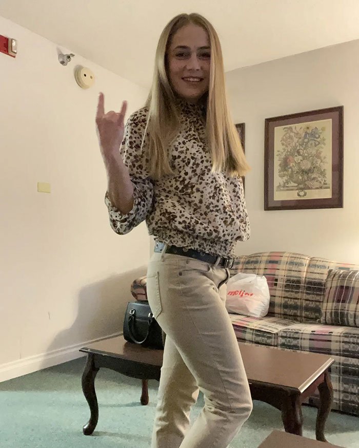 Young woman posing indoors in casual clothes, linked to racist Cinnabon worker viral tirade and criminal past reveal.