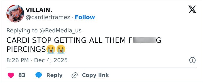 Social media user reacting with emojis and text criticizing Cardi B&rsquo;s new neck and back piercings.