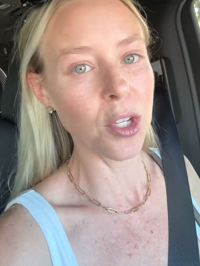 Woman in car expressing distress, representing a SAHM at a loss after husband asks for divorce unexpectedly.