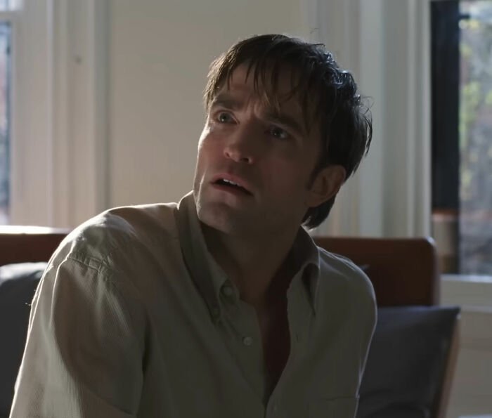 Robert Pattinson looking surprised in a scene related to Zendaya's viral engagement ad dropping recently.