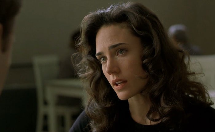 Jennifer Connelly in a close-up scene from The Horse Has No Regrets, expressing emotion during an intense movie moment.