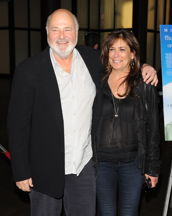 Rob Reiner and wife smiling together at an event, linked to Trump controversy over TDS claims.