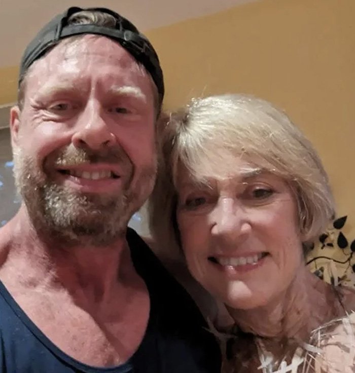 Man and woman smiling together indoors, highlighting ChatGPT accused of turning son against mother in viral story.