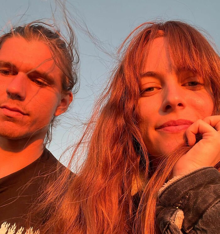 Riley Keough and a young man outdoors at sunset, relating to court docs about John Travolta’s son Ben’s biological mother.
