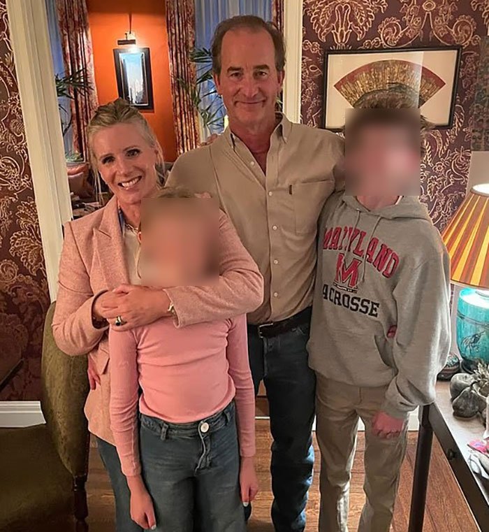 HR exec Kristin Cabot smiling with family in a warmly decorated room, breaking silence after Coldplay kiss cam incident.