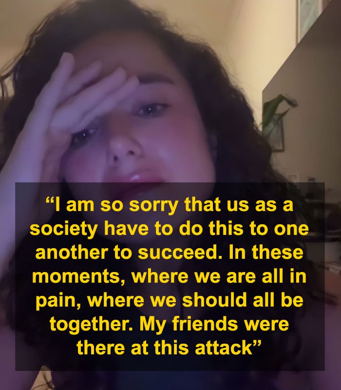 Young woman with curly hair holding her head, expressing distress after Bondi Beach attack controversy involving swimwear model.