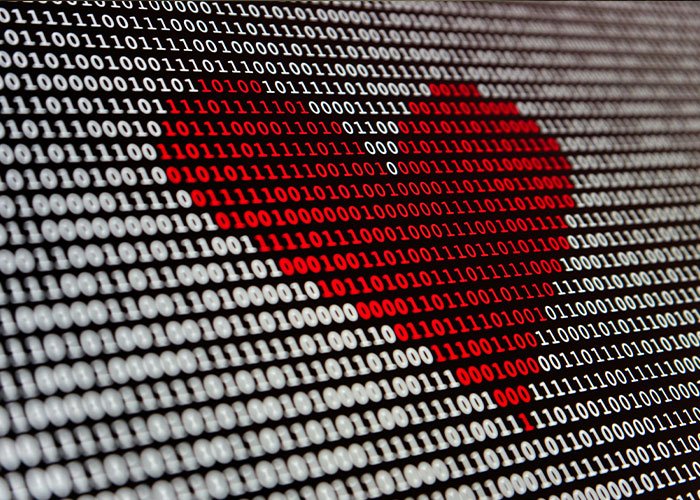 Binary code screen with red heart symbol representing website offering intimate encounters and K-Drama-style dates.