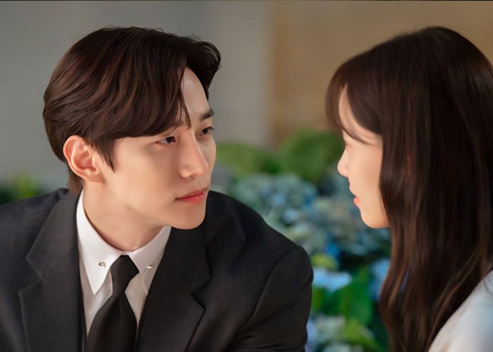 A man and woman having a K-Drama-style date in a close, intimate setting representing Korean encounters.