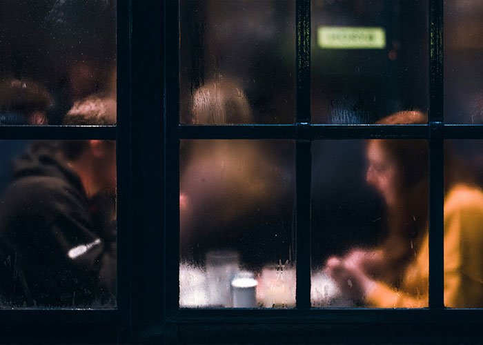 People having intimate encounters and K-drama-style dates seen through a foggy window at night.