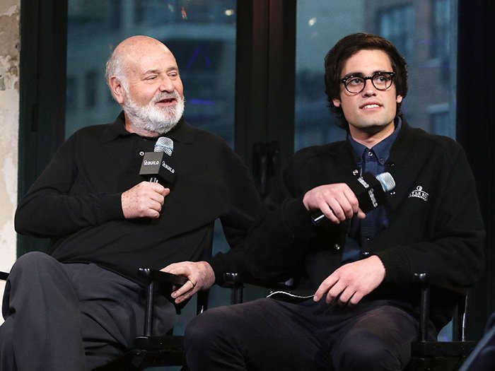 Conan O’Brien and Nick Reiner holding microphones during a discussion, referencing explosive fight at party incident.