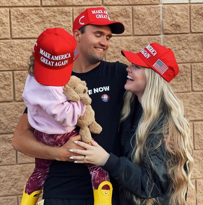 Family wearing Make America Great Again hats at an event, capturing an awkward Freudian slip moment going viral.