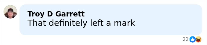 Screenshot of a social media comment saying "That definitely left a mark" reacting to Jake Paul's broken jaw incident.