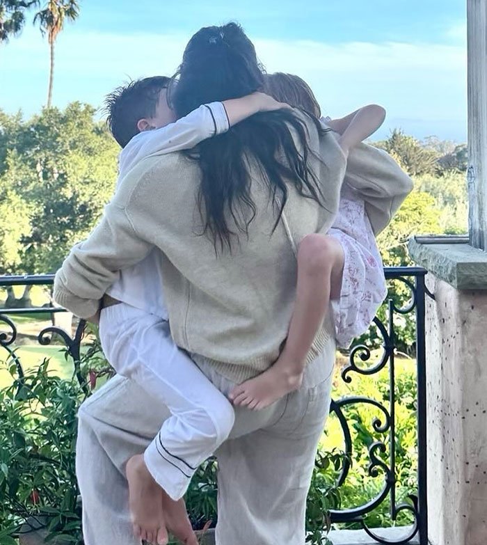 Meghan Markle and children share a tender moment outdoors in a holiday snap raising discussion about manipulation details.
