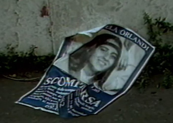 Crumpled missing person poster of the Vatican Girl lies on the ground, linked to decades-old cold case investigation.