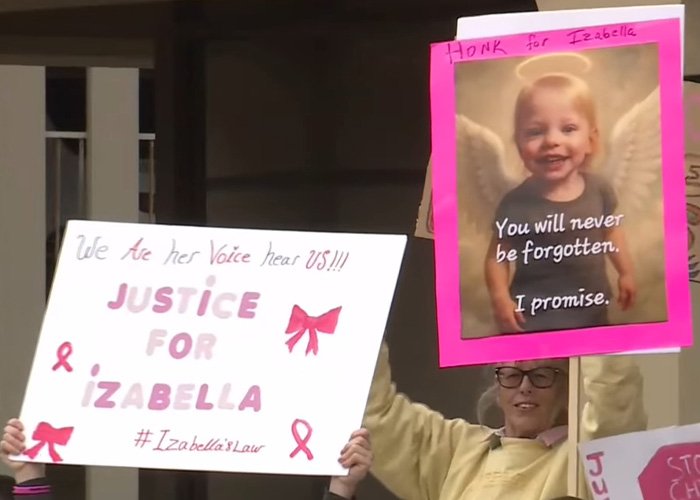 Protesters holding signs demanding justice for Izabella, highlighting mom’s chilling Google searches amid slaying charges.
