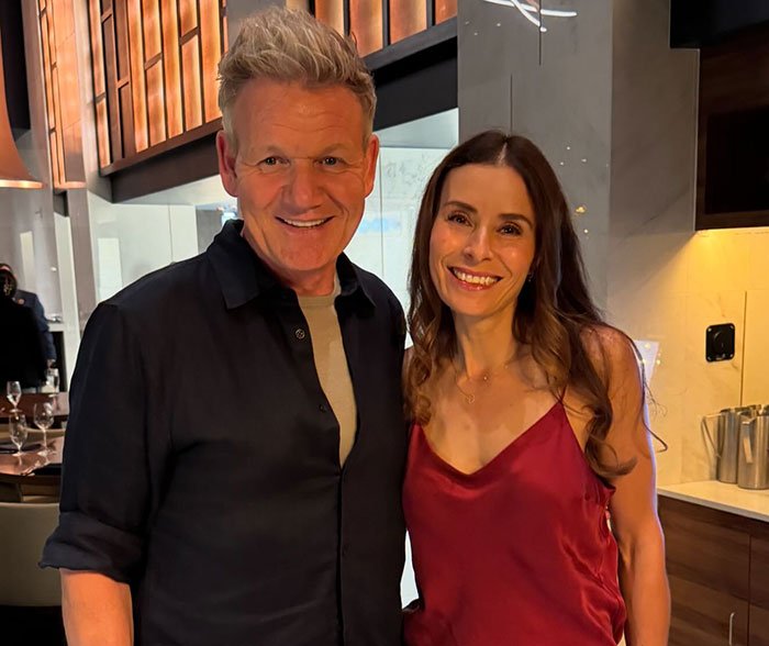 Gordon Ramsay smiling with daughter at wedding reception after aunt’s controversial text about speech.