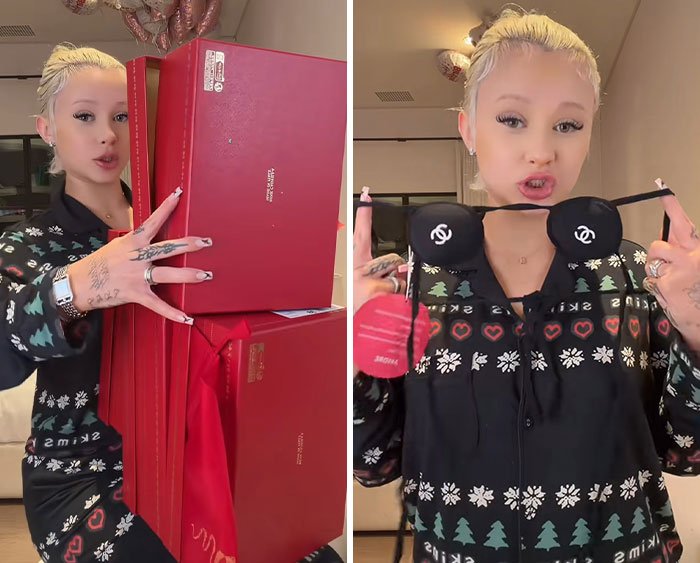 Young woman holding red gift boxes and showing an intimate designer gift, related to Kourtney Kardashian and Travis Barker backlash.