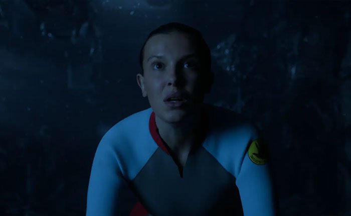 Eleven from Stranger Things 5 in a dark scene, highlighting reactions to the comically bad penultimate episode online.