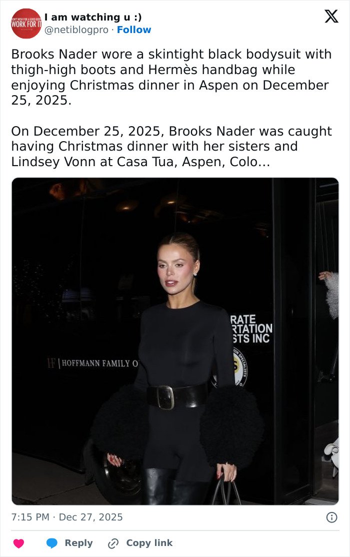 Brooks Nader wearing black skintight bodysuit with a bold belt styled as a shirt in Aspen at night.