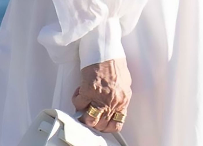 Close-up of Kris Jenner’s hand without gloves, showcasing her rings and natural skin after viral $100k facelift.
