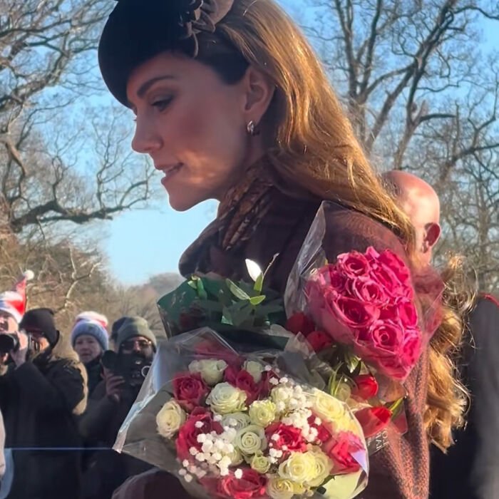 Kate Middleton outdoors holding bouquets of flowers, her facial scar fueling 2024 hospitalization rumors.