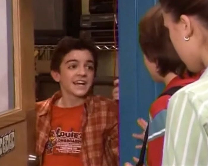 Young actor Tylor Chase in a scene with co-stars discussing his homelessness and urgent support requests.