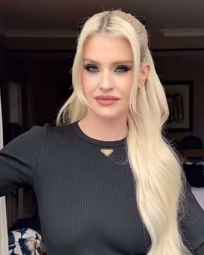 Kelly Osbourne with long blonde hair and black top, appearing in a close-up shot discussing transformation and Ozzy.