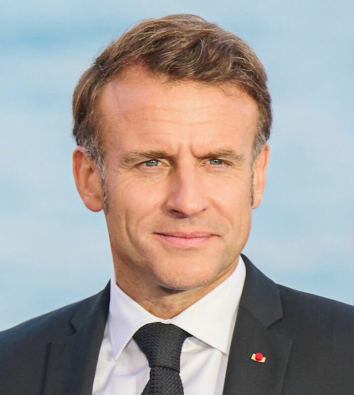 French soldier's odd behavior behind Macron and its impact amid France is boiling conspiracy theories discussed.