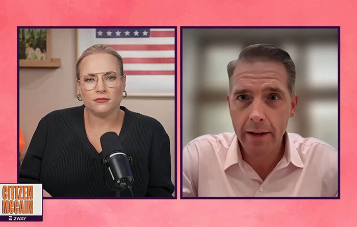 Two people in a virtual interview discussing Scott Jennings hitting back at Michael Douglas and Zeta-Jones over nepo baby son's debate flop.