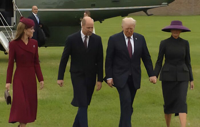 Melania Trump and others walking on grass near a helicopter showing Melania Trump's body language at Mar-a-Lago event