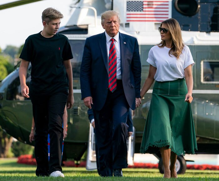 Donald Trump and Melania Trump walking outdoors near a helicopter, related to Mar-a-Lago rules controversy.