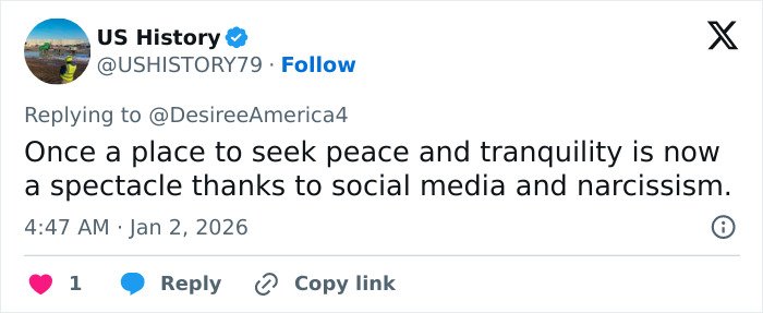 Screenshot of a tweet about the viral Red Rock Canyon incident involving the first Karen of 2026 blocking a tourist’s shot.
