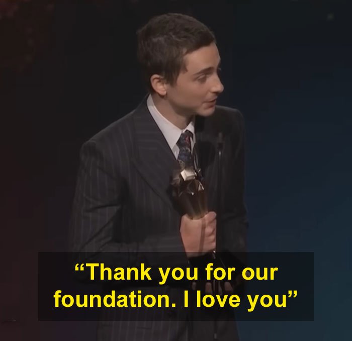 Timothée Chalamet holding an award, speaking at Critics Choice Awards, viral video of using Kylie's BBL to stand up.