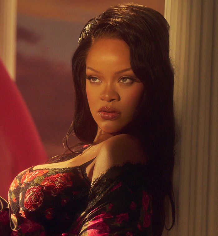 Woman in floral black lingerie and robe, warm cinematic lighting, shown in distorted lingerie photos controversy