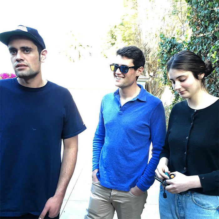 Nick Reiner’s family outside, reacting after his lawyer suddenly quits the case, showing mixed emotions and casual attire.