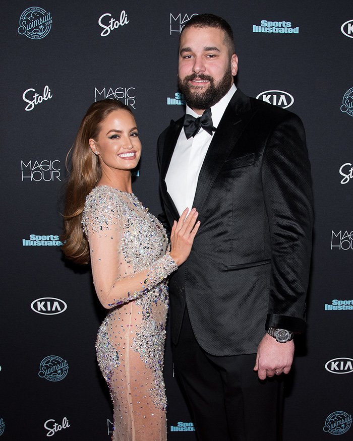 Former NFL star with his ex-wife posing at a formal event amid legal dispute over invasive comments on manhood size
