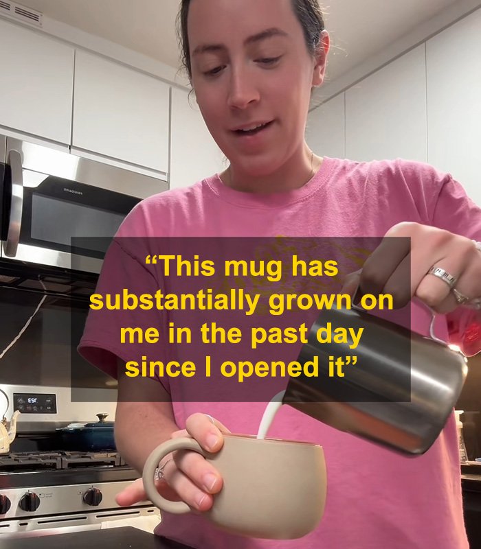 Woman in pink shirt pouring milk into a coffee mug, highlighting fiancé’s mug gift sparking relationship debate online.