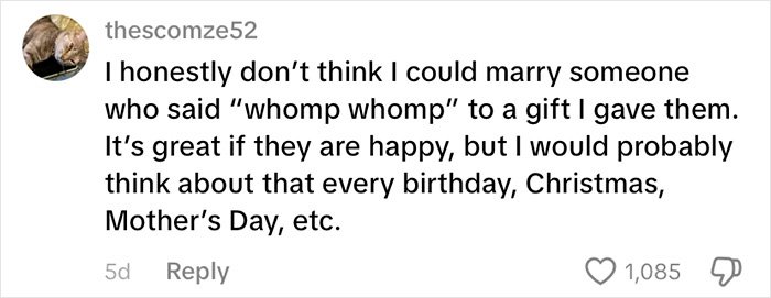 Screenshot of a social media comment debating a fiancé’s mug gift with the phrase he needs to run sparking relationship opinions online.