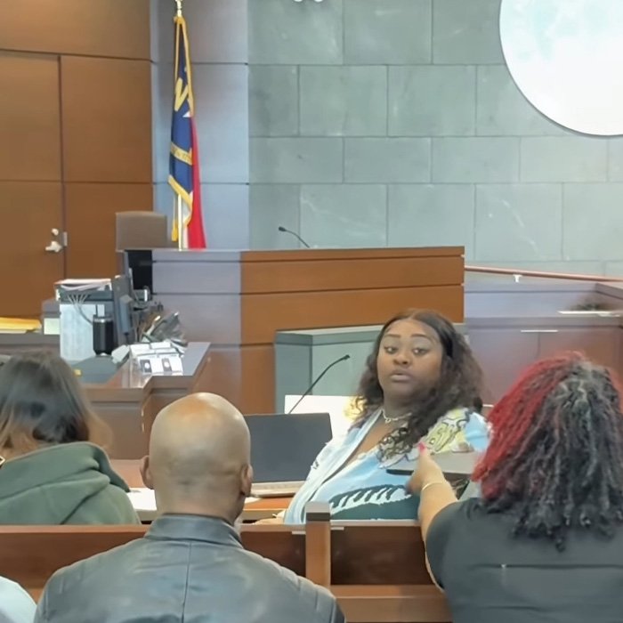 TikTok influencer in a courtroom scene facing legal action after admitting inappropriate act in couple’s home.