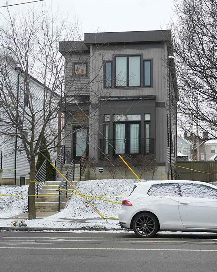Ohio house with police tape outside, related to ex FBI agent’s insight on twisted homicide of dentist and wife.