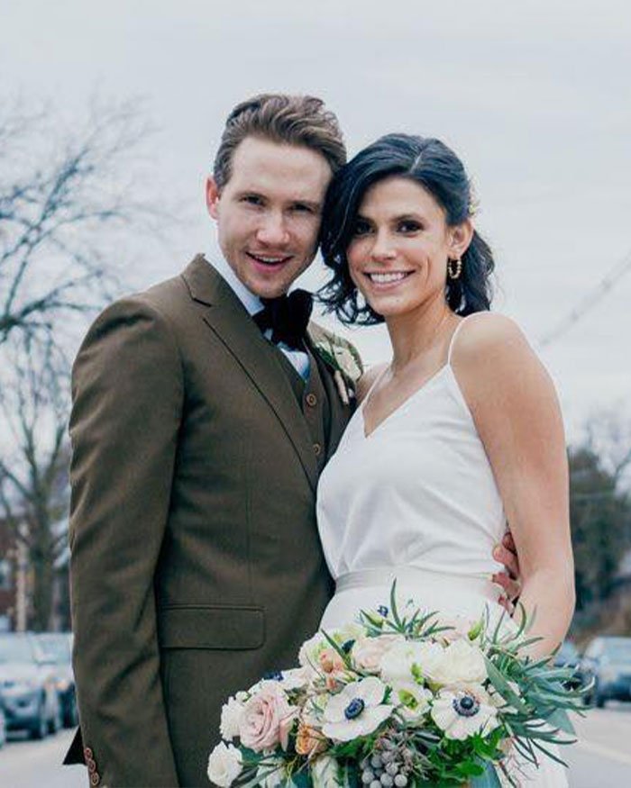 Young couple in wedding attire outdoors, linked to Ohio dentist homicide case with possible motive suggested by ex FBI agent.